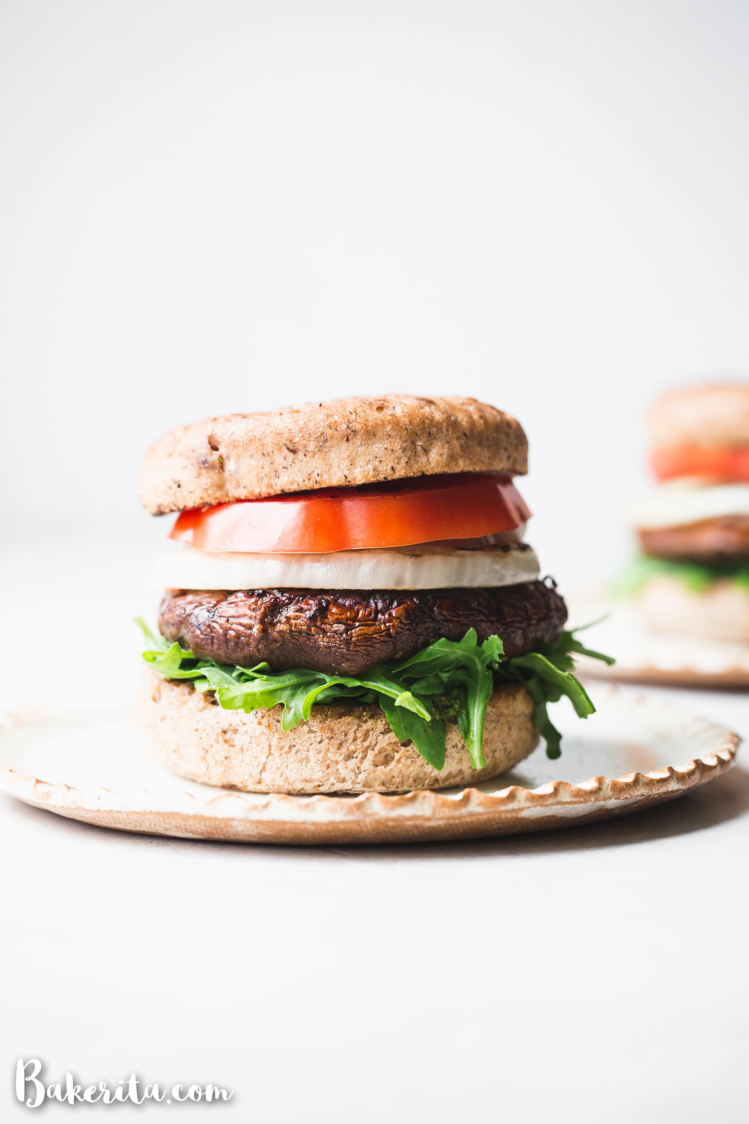 These Vegan Grilled Portobello Burgers are packed with savory, umami flavor thanks to the scrumptious marinade. When piled high with additions like grilled onions and vegan pesto, it's a burger you'll want to make every weekend. The grilled portobello mushrooms are also perfect as a side dish.