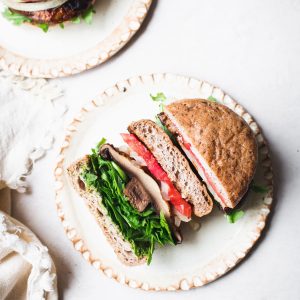 These Vegan Grilled Portobello Mushroom Burgers are packed with umami flavors thanks to the scrumptious marinade. When piled high with additions like grilled onions and vegan pesto, it's a burger you'll want to make every weekend. The grilled portobello mushrooms are also perfect as a side dish all on their own.