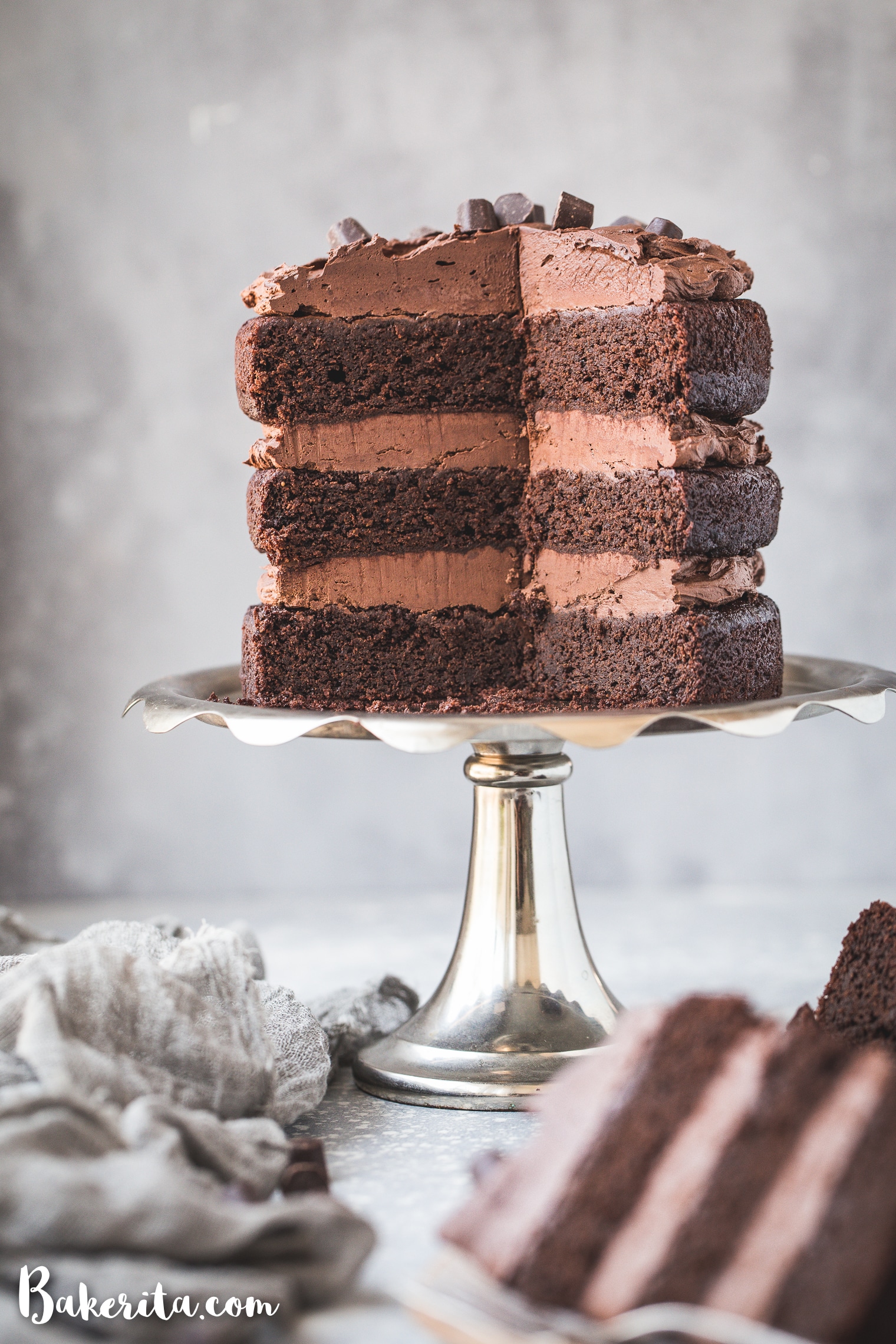 Paleo Chocolate Cake with Vegan Chocolate Ganache Frosting - a quick and easy cake recipe with a simple 2-ingredient frosting! This layer cake is gluten-free, paleo, dairy-free, and vegan, and it tastes as decadent as your favorite chocolate cake.