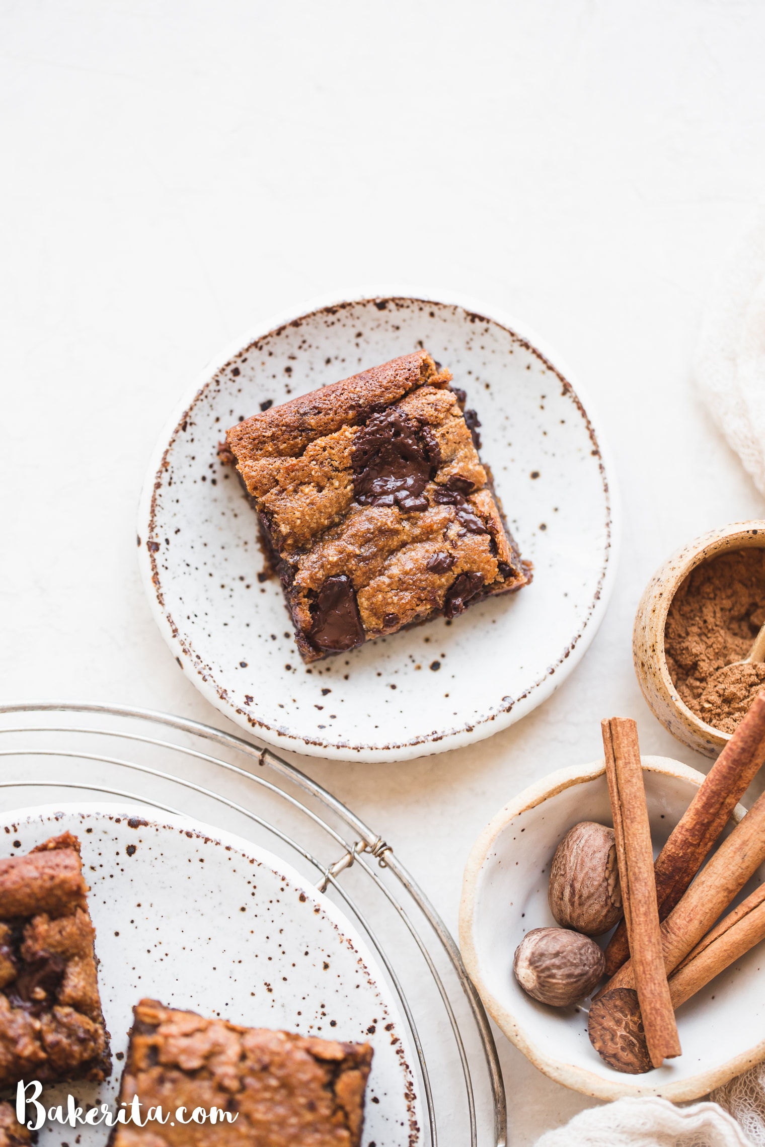 These Gluten-Free Vegan Sweet Potato Blondies taste like fall in a bar cookie! With warm spices and dark chocolate chunks, these decadent blondies will satisfy your fall dessert cravings.