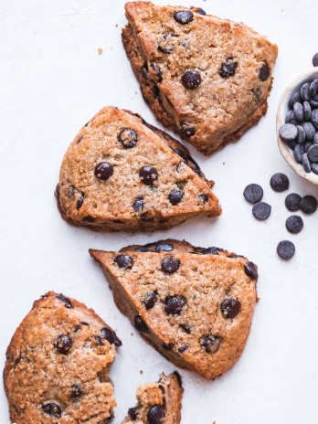These Vegan Gluten-Free Chocolate Chip Scones are everything a good scone should be: tender and fluffy on the inside, with a crispy, slightly crumbly exterior. These paleo scones are loaded with chocolate chips and make for a delicious breakfast, snack, or dessert.