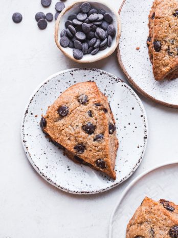 These Vegan Gluten-Free Chocolate Chip Scones are everything a good scone should be: tender and fluffy on the inside, with a crispy, slightly crumbly exterior. These paleo scones are loaded with chocolate chips and make for a delicious breakfast, snack, or dessert.
