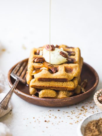 These Gluten-Free Vegan Pumpkin Waffles are easy to make with a crispy exterior and a warm, fluffy inside. They're freezer-friendly too, making them perfect for meal prep!
