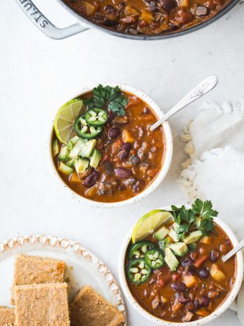 This Vegan Chili doesn't lack any heartiness just because it doesn't have any meat. It's loaded up with veggies, beans, and tons of spices -- this is the BEST vegan chili recipe I've had!