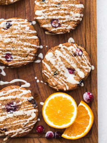 These Gluten-Free Vegan Cranberry Orange Scones will be your new favorite vegan breakfast. This easy scone recipe is made with fresh and dried cranberries, fresh orange juice and zest, and a simple orange glaze for maximum flavor.