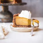This Baked Vegan Pumpkin Cheesecake will wow you with its rich texture, spices, and graham cracker style crust. It's the perfect vegan Thanksgiving dessert.