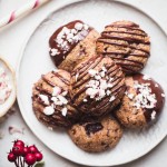 These Gluten-Free Vegan Peppermint Chocolate Chip Cookies will make your cookie dreams come true! They make perfect Christmas cookies and taste so scrumptious, especially with the extra chocolate drizzle.