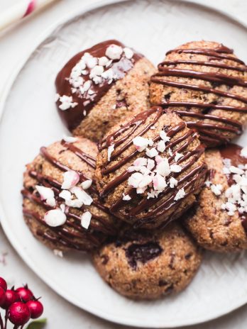 These Gluten-Free Vegan Peppermint Chocolate Chip Cookies will make your cookie dreams come true! They make perfect Christmas cookies and taste so scrumptious, especially with the extra chocolate drizzle.