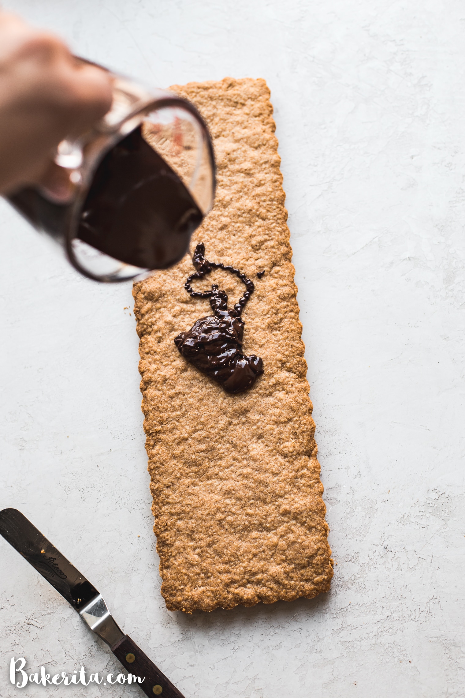 This Gluten-Free Vegan Shortbread recipe tastes rich and buttery - without the butter. This simple recipe is made with just FOUR ingredients and can be topped with chocolate for an extra-special holiday treat.