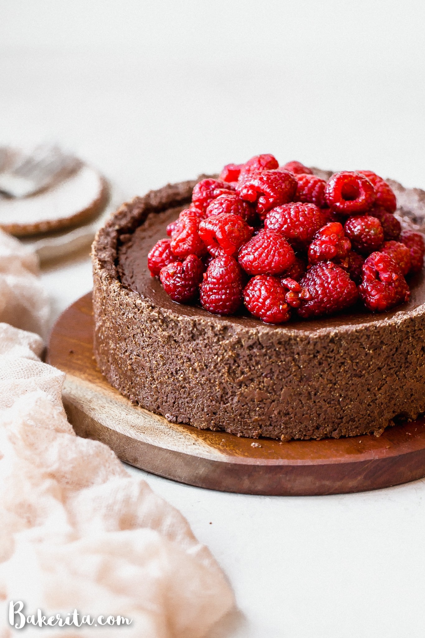 This Baked Vegan Chocolate Cheesecake will make your mouth water! It's super creamy and delicious, with a rich chocolate flavor and a tasty gluten-free chocolate crust.