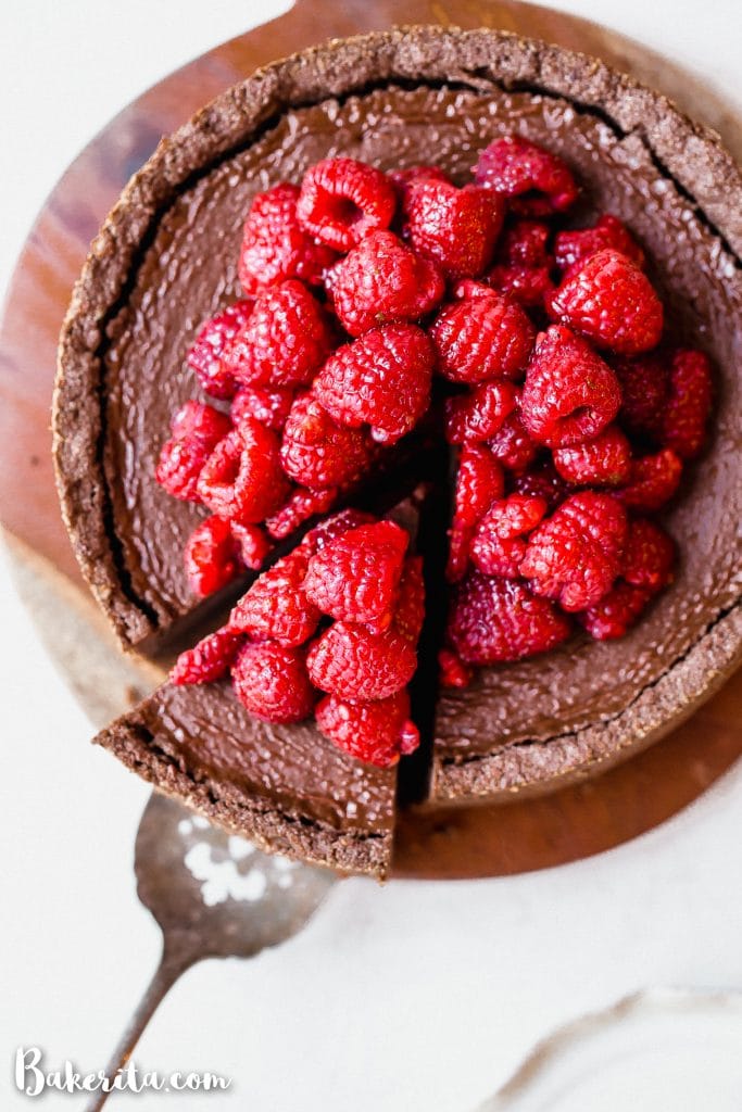 This Baked Vegan Chocolate Cheesecake will make your mouth water! It's super creamy and delicious, with a rich chocolate flavor and a tasty gluten-free chocolate crust.