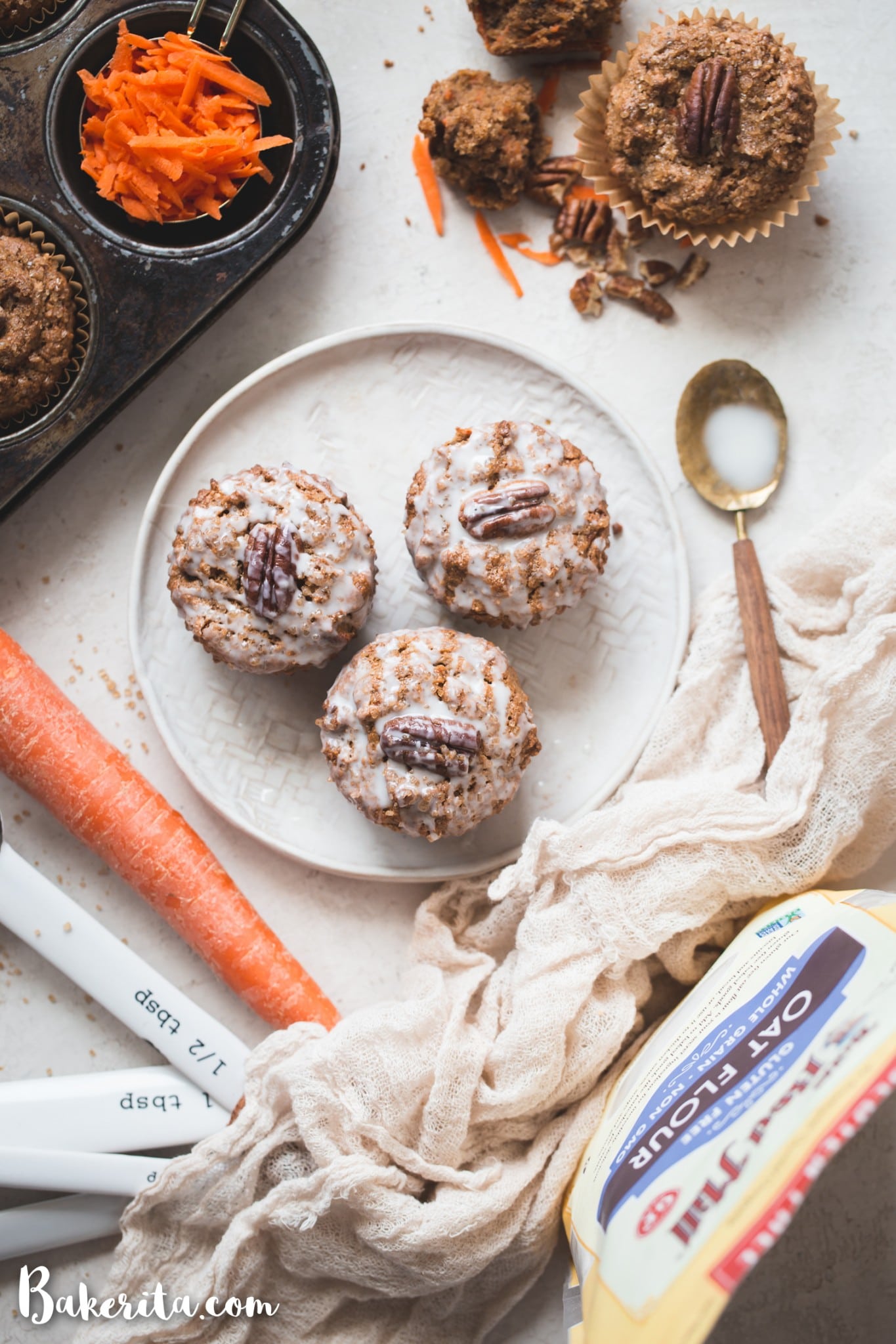 These Gluten-Free Vegan Carrot Cake Muffins are so tender and flavorful! They're the perfect healthy breakfast or snack to enjoy all year long. You'll love these simple carrot muffins!