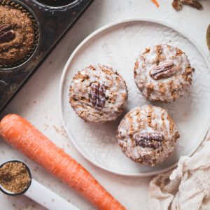 These Gluten-Free Vegan Carrot Cake Muffins are so tender and flavorful! They're the perfect healthy breakfast or snack to enjoy all year long. You'll love these simple carrot muffins!