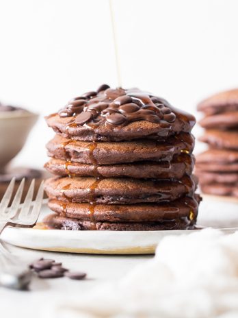 These Gluten-Free Vegan Double Chocolate Pancakes are a deliciously fluffy and decadent breakfast! Made with rolled oats and loaded with chocolate chips.