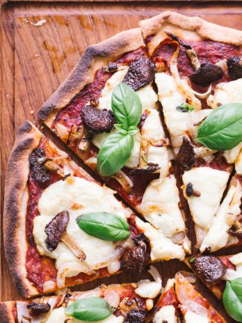 You'll be surprised at how easily this Gluten-Free Vegan Pizza with Mushrooms & Onions comes together! It is made with my new favorite gluten-free pizza crust and topped off with tomato sauce, homemade vegan mozzarella cheese, mushrooms and onions. Perfect for pizza night!