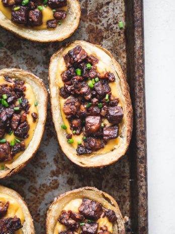 These Vegan Potato Skins are my new favorite vegan appetizer! Baked instead of fried, these are a healthier take on the classic. They're made with vegan cheese sauce and the best tempeh bacon bits.