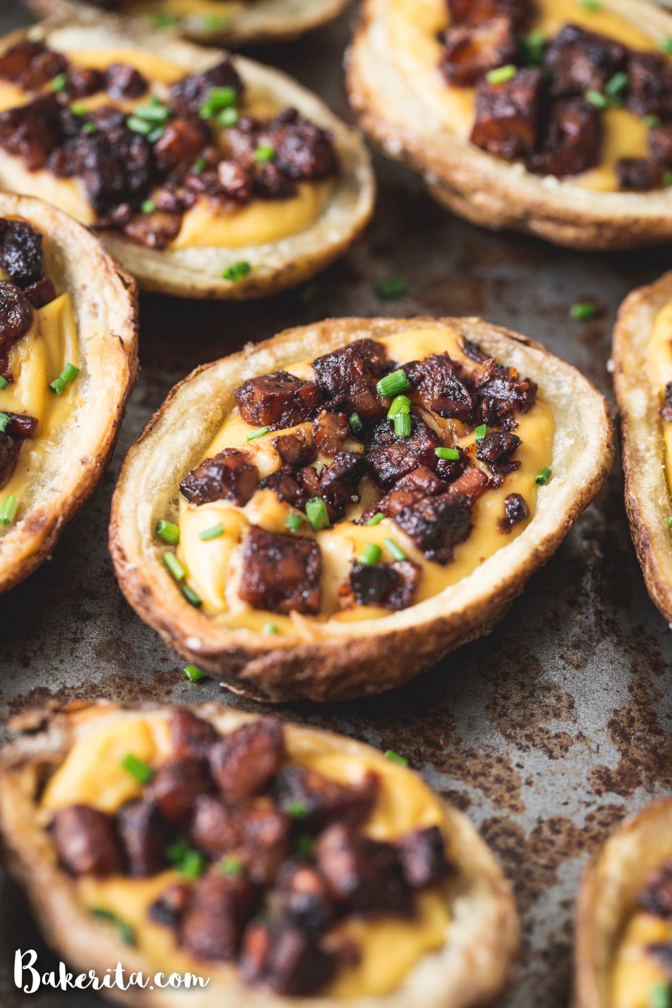 These Vegan Potato Skins are my new favorite vegan appetizer! Baked instead of fried, these are a healthier take on the classic. They're made with vegan cheese sauce and the best tempeh bacon bits.