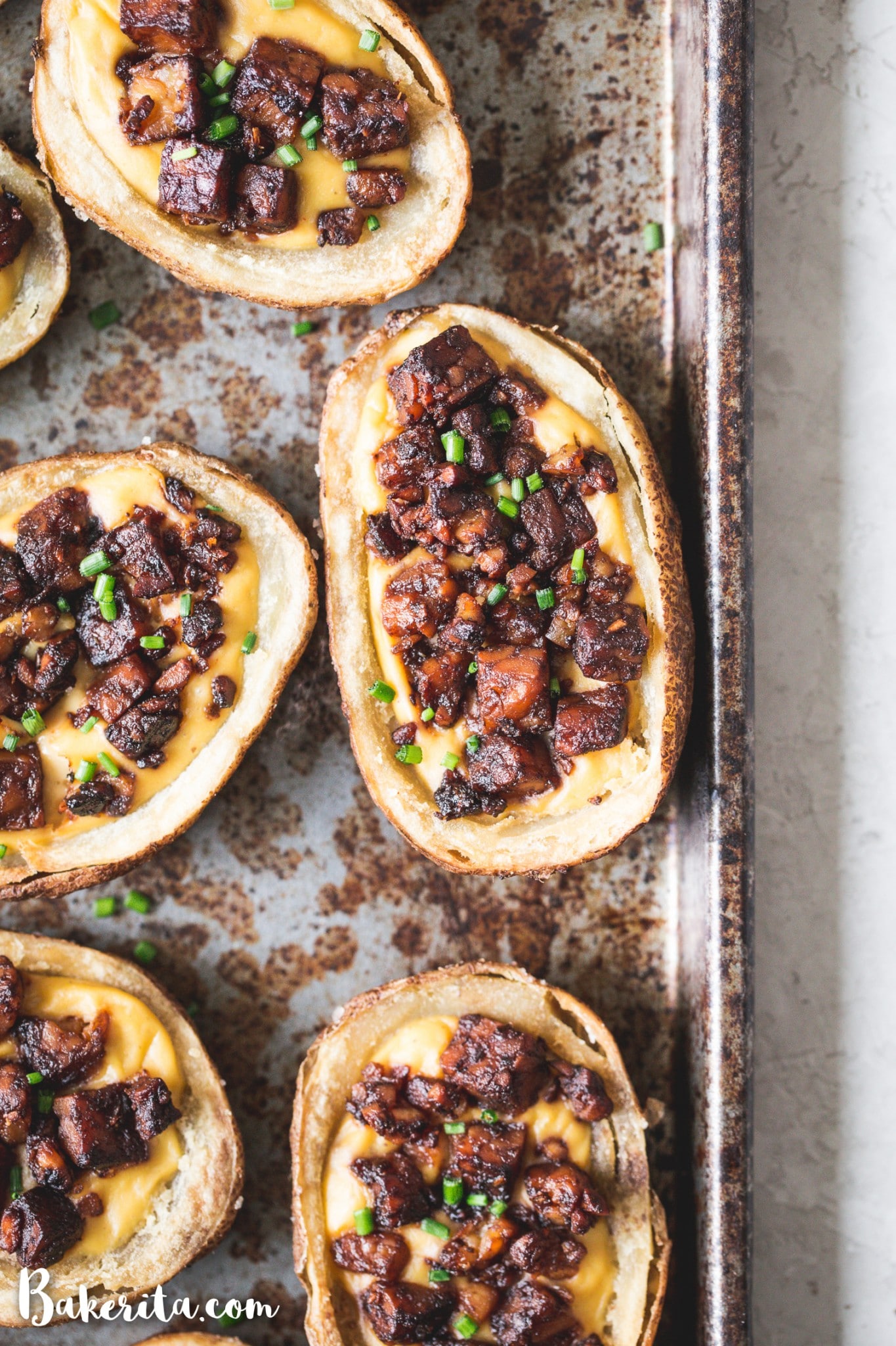 These Vegan Potato Skins are my new favorite vegan appetizer! Baked instead of fried, these are a healthier take on the classic. They're made with vegan cheese sauce and the best tempeh bacon bits.