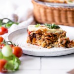 This is the BEST Vegan Lasagna! It's layered with vegan almond ricotta, mushroom tempeh marinara sauce, and topped with a simple vegan mozzarella cheese that bubbles and browns. It's easy to make gluten-free as well!