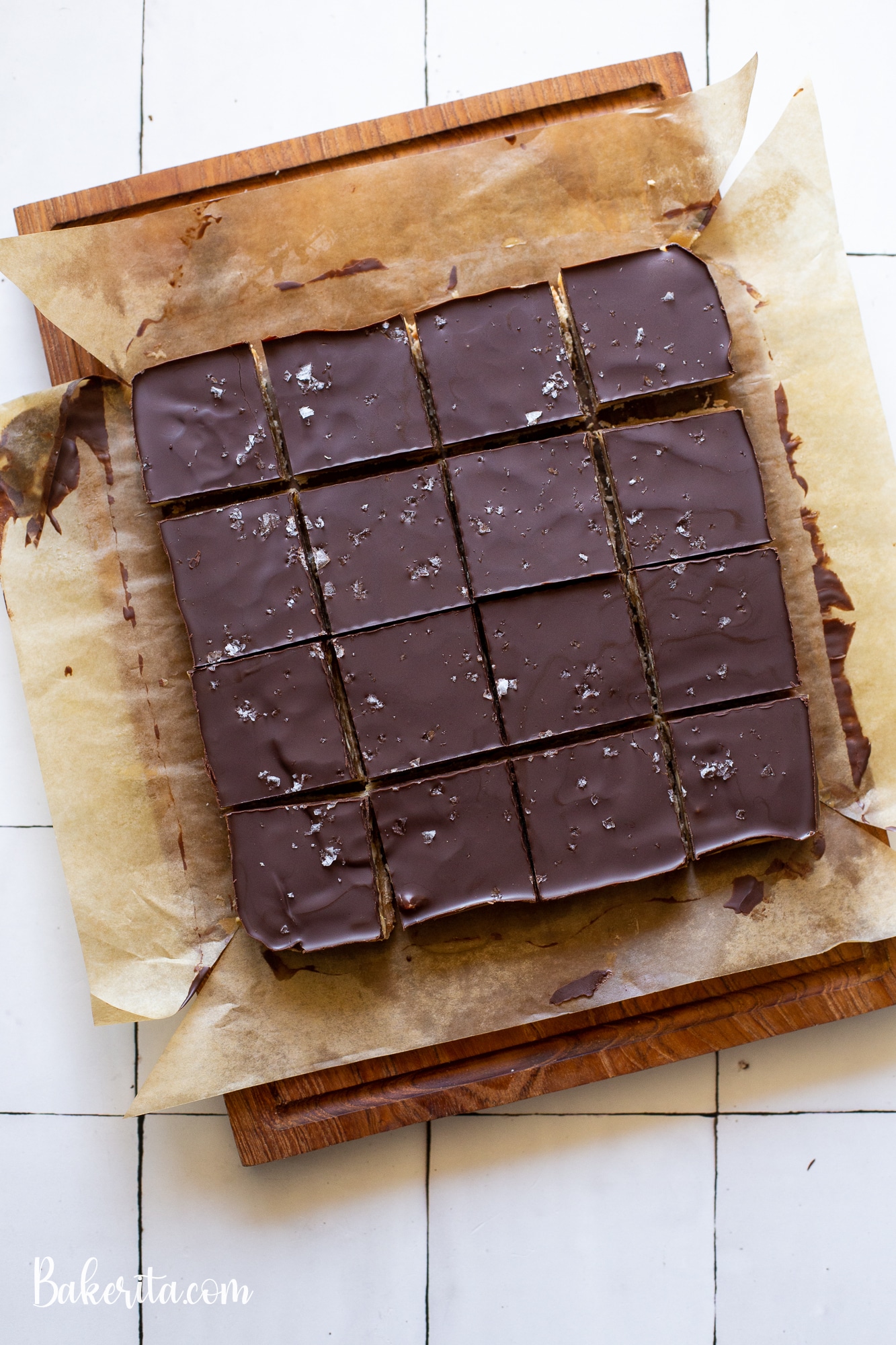 Calling all peanut butter lovers! These Gluten-Free Vegan Peanut Butter Millionaire's Shortbread will knock your socks off. They have a layer of coconut flour shortbread, a quick no-cook peanut butter caramel, and a layer of dark chocolate.