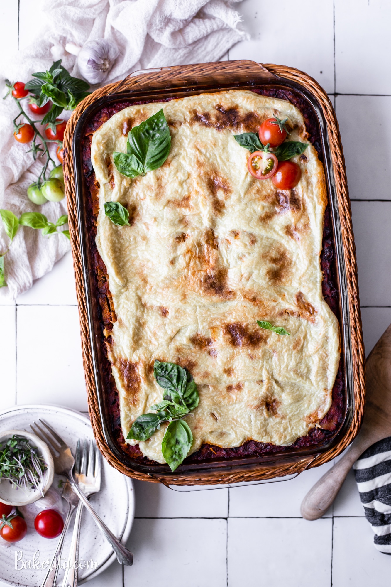 This is the BEST Vegan Lasagna! It's layered with vegan almond ricotta, mushroom tempeh marinara sauce, and topped with a simple vegan mozzarella cheese that bubbles and browns. It's easy to make gluten-free as well!