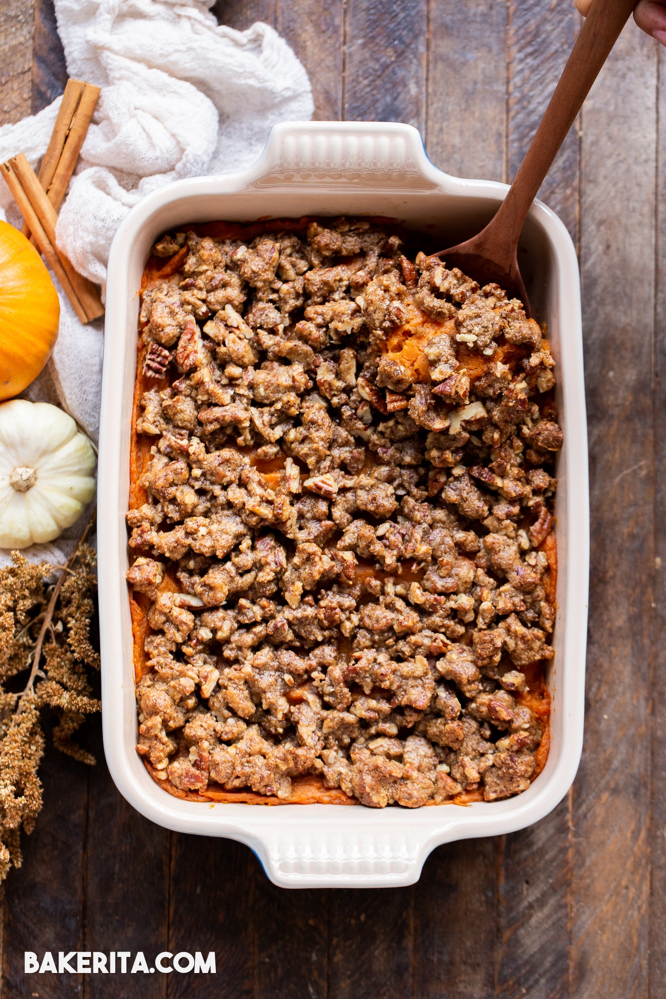 This Vegan Sweet Potato Casserole with Gluten-Free Pecan Crumble recipe is the best sweet potato casserole ever! It's made with fresh yams and coconut sugar for subtle sweetness that pairs perfectly with the rest of your holiday meal. With a crispy gluten-free pecan crumble topping, you'll definitely be serving yourself seconds. It's easy to make the day of, or can be prepared in advance for an easy make-ahead holiday side dish.